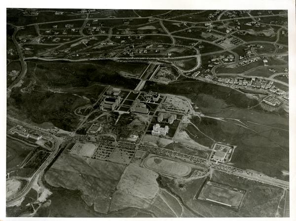 Aerial view of Westwood campus, esplanade, arroyo, and bridge, ca. 1930's