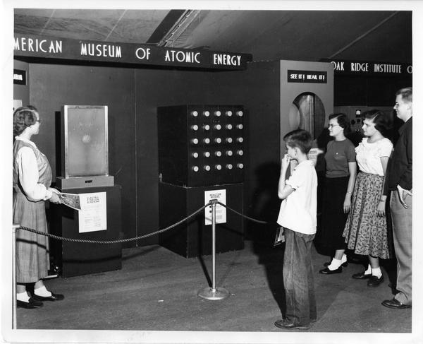 Students view the Dunning exhibit at the traveling Atomic Energy Exhibit, 1951