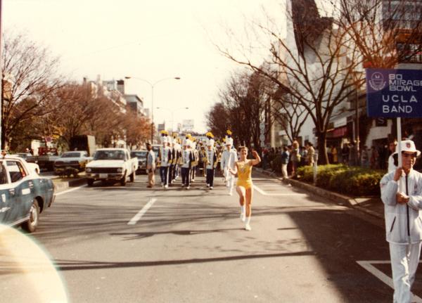 UCLA marching band marching on street for 80 Mirage Bowl