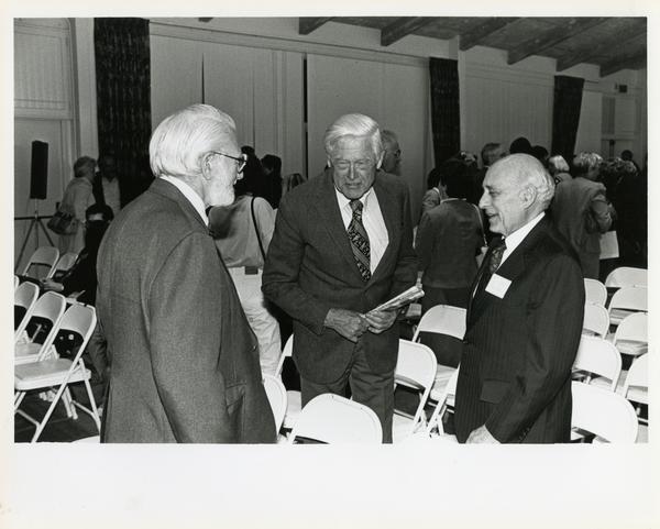Attendees conversing, Breslow Lecture, 1991