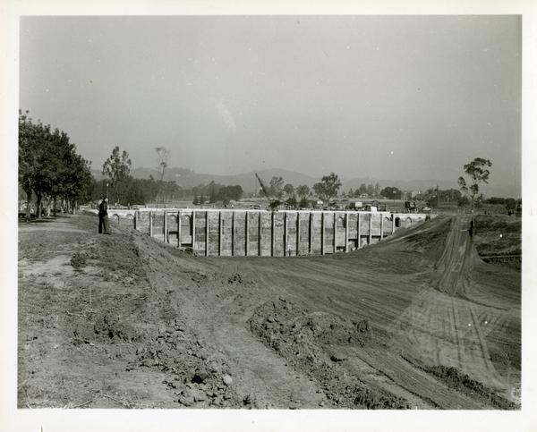 View of construction site of bridge across the deep arroyo