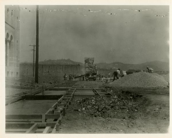View of men at work during construction of Campbell Hall