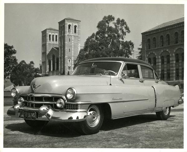 Car parked on campus with Royce Hall in the background, 1951