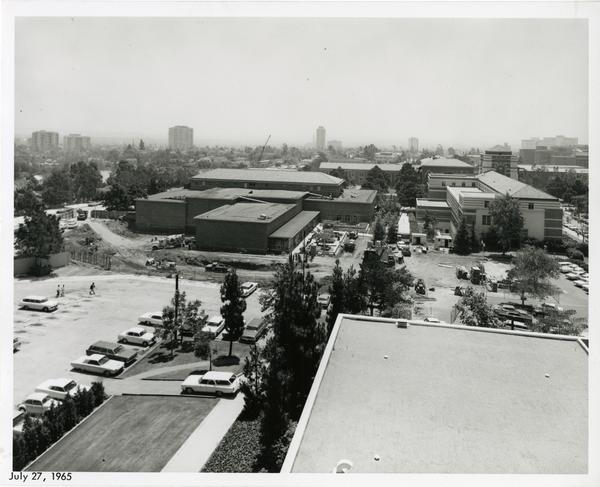 View of UCLA campus buildings and parking lots, July 1965