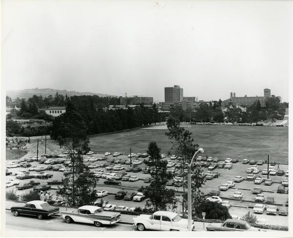 Parking lot with campus buildings in the background, May 1963