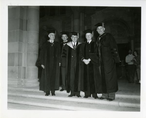 Group of men stand on the steps of Royce Hall on Charter Day, 1950