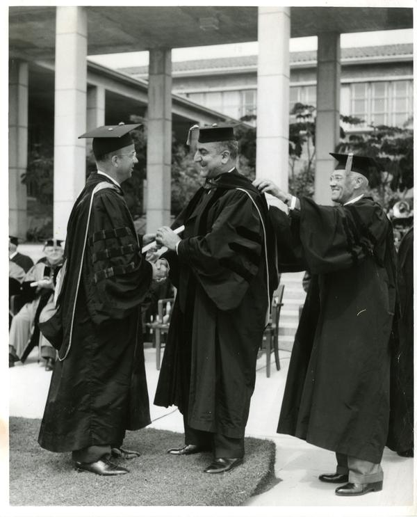 Charles Malik receives honorary degree from President Clark Kerr and Chancellor Vern O. Knudsen on Charter Day 1960