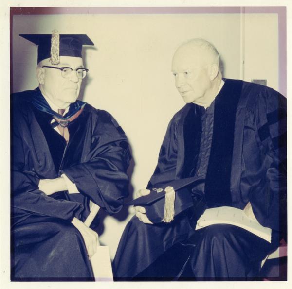 Chancellor Franklin Murphy and former President Dwight Eisenhower in academic gowns, Charter Day 1963