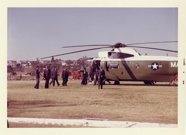 President Johnson descending from Presidential helicopter, Charter Day 1964