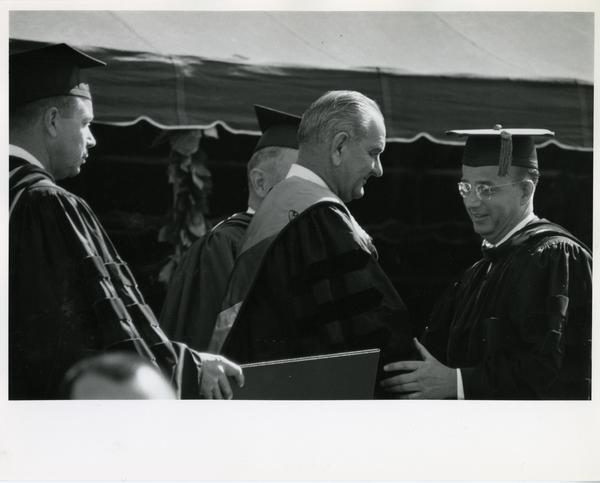 President Lyndon B. Johnson receiving honorary degree from UC President Clark Kerr, Charter Day 1964