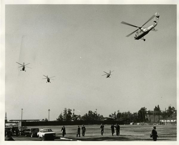 Helicopters flying over UCLA campus February 21, 1964
