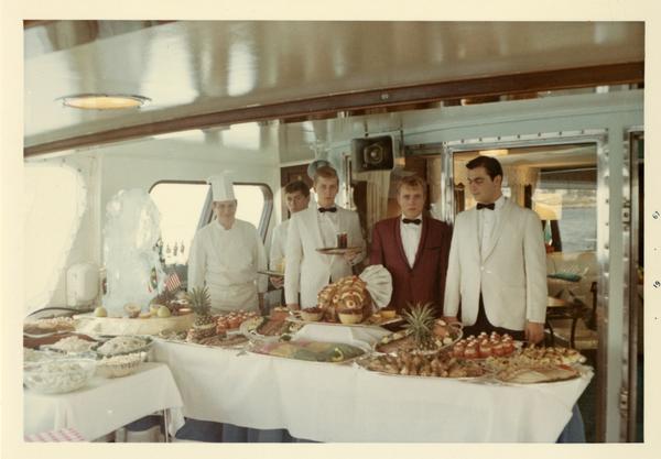 Yacht staff with food prepared for Emperor Haile Selassie's visit, 1967