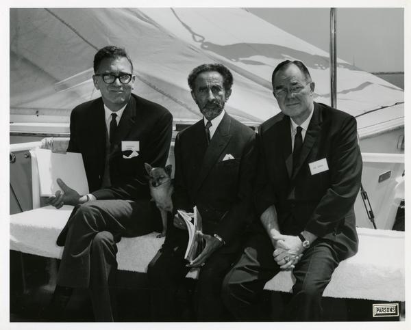 Emperor Haile Selassie of Ethiopia with his dog and two men on Motor Yacht Argo, April 25, 1967