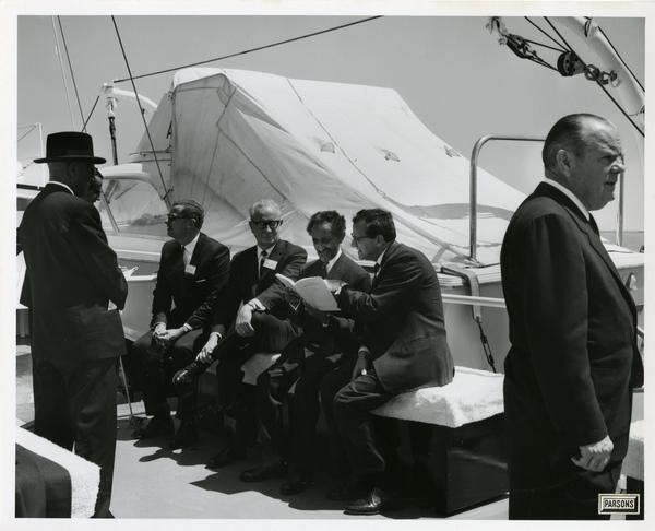 Emperor Haile Selassie looking over documents aboard Motor Yacht Argo, April 25, 1967
