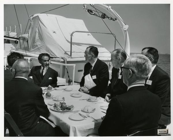 Emperor Haile Selassie eating at the table upon the Motor Yacht Argo, April 25, 1967
