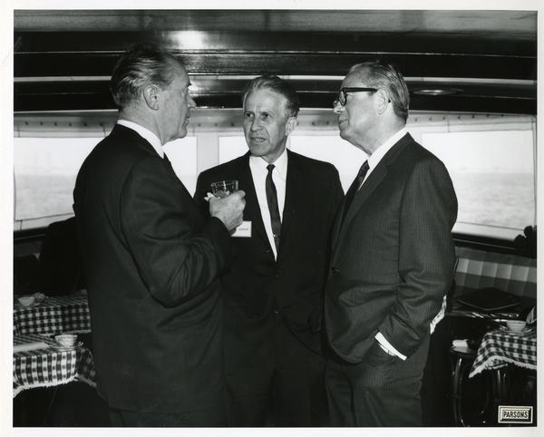 Men talking aboard the Motor Yacht Argo, April 25, 1967