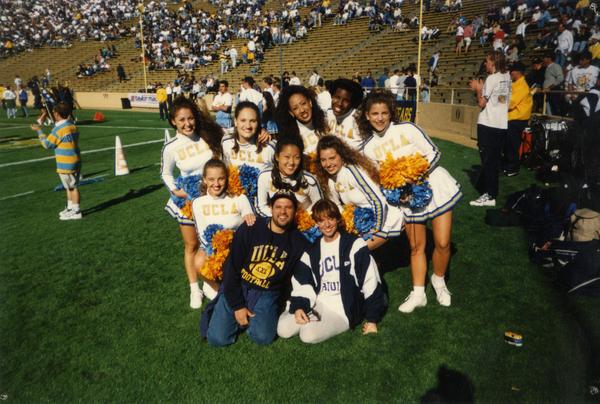 Cheerleaders gathered on field for a game
