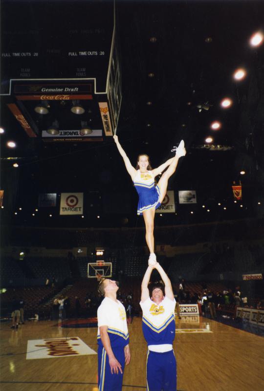 Cheerleaders performing at basketball game, 1998