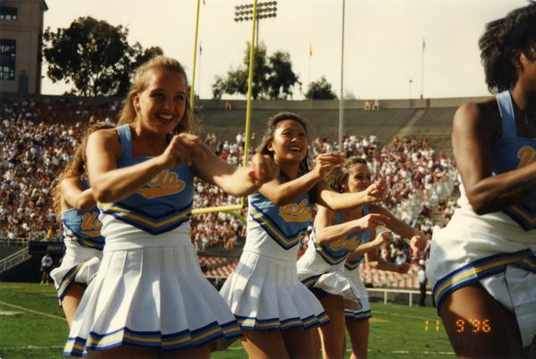 UCLA cheerleaders performing a routine at the football game