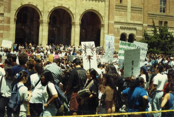 View of Chicano/a student rally attendees gathered in front of Royce Hall, 1993