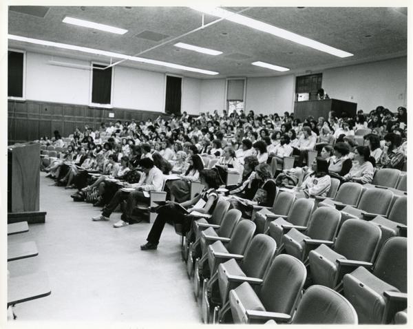 Side view of students in a lecture hall, circa 1985