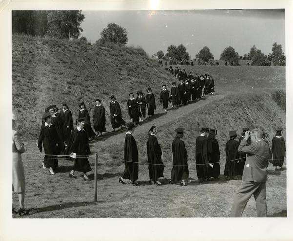 Students filing in for Commencement, circa 1940's
