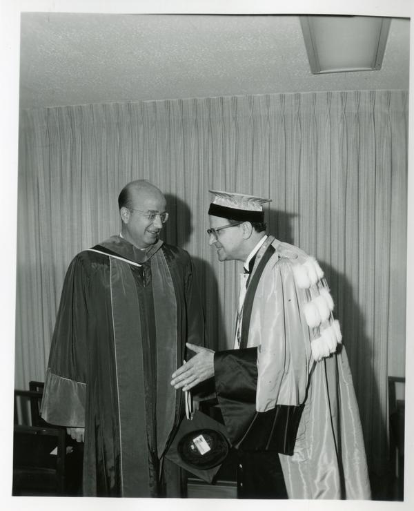 President Clark Kerr with unidentified man at Commencement, June 9, 1966