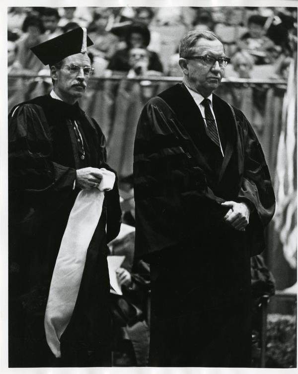 Louis Booker Wright and Robert Vosper walking on stage at Commencement, June, 1967