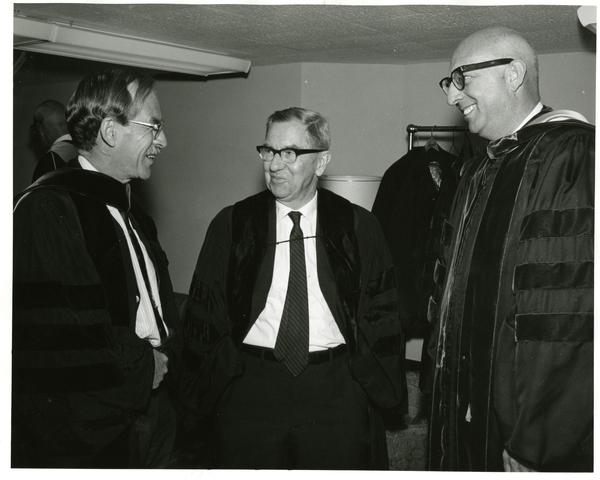 Louis Booker Wright, Robert Vosper and another man talking at Commencement, June, 1967