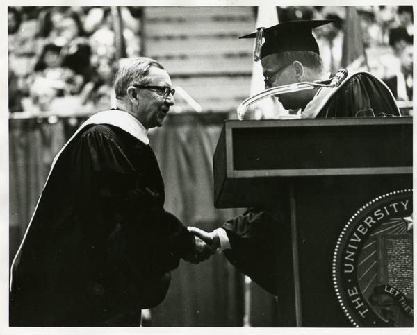 Louis Booker Wright shaking hands with President Kerr at Commencement, June 1967