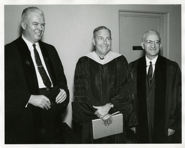 Honorary award recipient with two unidentified men at Commencement, June 14, 1968