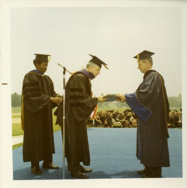 Man receiving his honorary degree at commencement, June 17, 1970