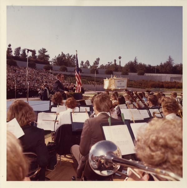 Robert Winslow directing the band at commencement, 1973