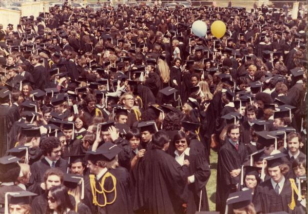 Graduates filing out at commencement, 1975