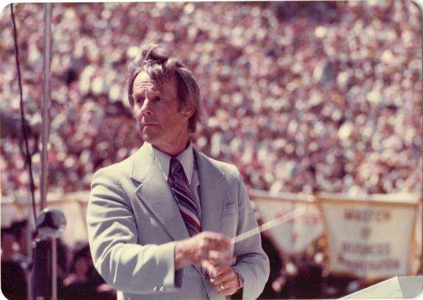 Conductor Kenneth Snapp instructing the band at commencement, June 1976