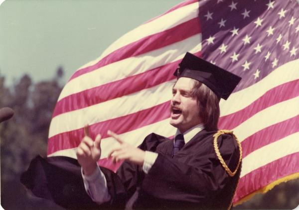 James Richard Hopfenbeck, the song leader, addresses the crowd at commencement, June 1976