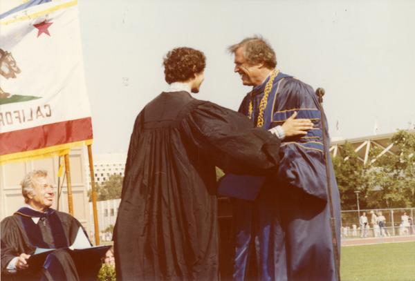 Graduate greets a member of the platform party at commencement, June 1979