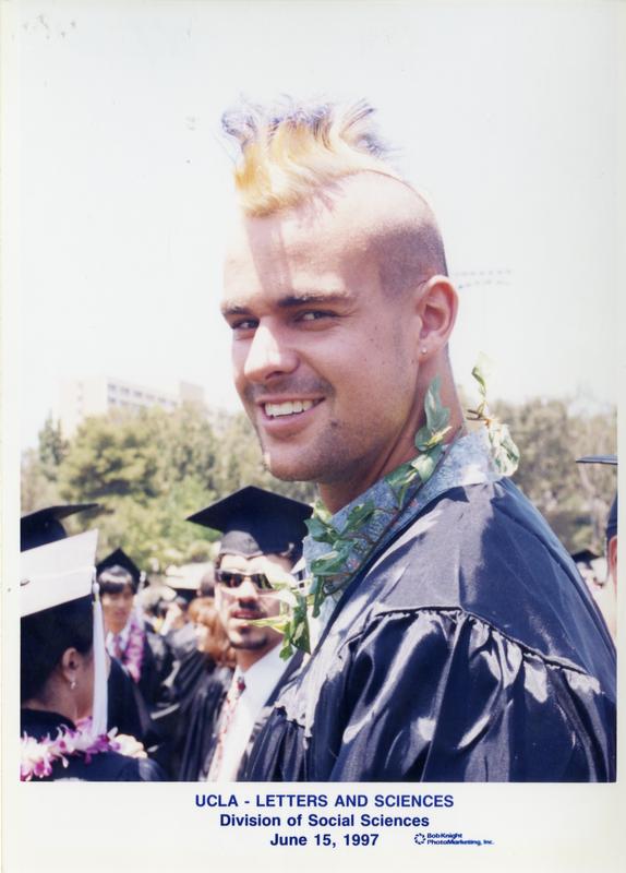 Graduate smiles for the camera at the commencement for the College of Letters and Sciences, Division of Social Sciences, June 15, 1997