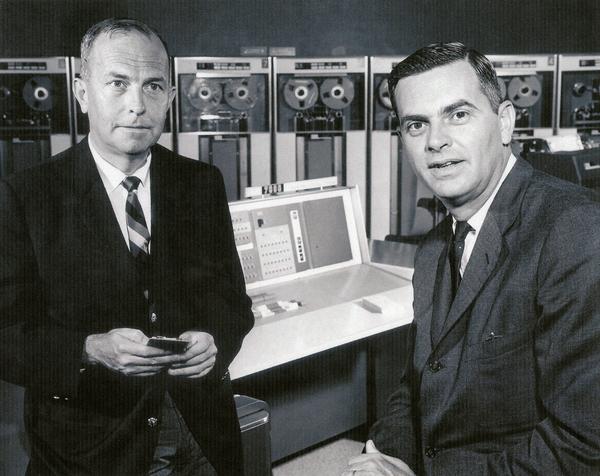 Two workers pose for the camera in the lab at the Western Data Processing Center