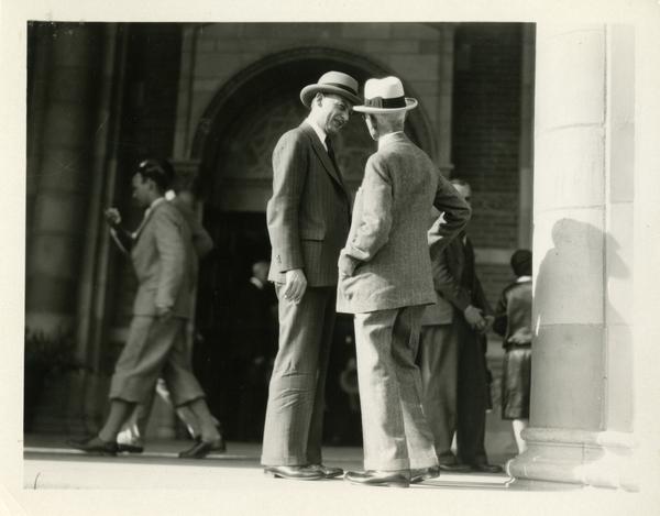 Robert Gordon Sproul talking with an unidentified guest on the steps of Royce Hall at the dedication of the Westwood campus, March 1930
