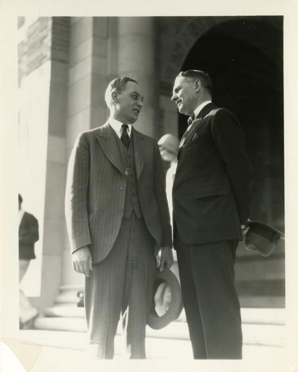 Robert Gordon Sproul talking with Regent Mortimer Fleishbacker on the steps of Royce Hall at the dedication of the Westwood campus, March 1930