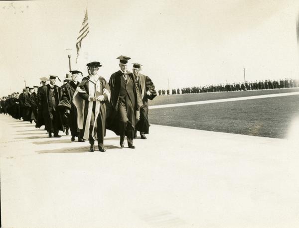 Academic procession heading towards Royce Hall for the dedication of the Westwood campus, March 1930