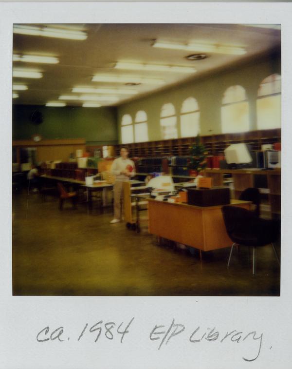 Unidentified man standing in the Education/Psychology Library during the 1984 move