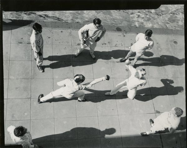 View from above of students engaging in fencing practice