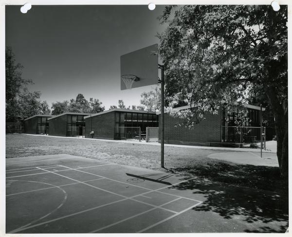 External view of classroom buildings from basketball courts