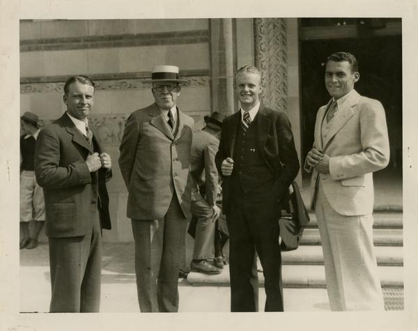 Kenny Piper, Dr. Ernest Carroll Moore, Bob Keith and Lowell Stanley stand in front of Powell Library on Opening Day, 1929