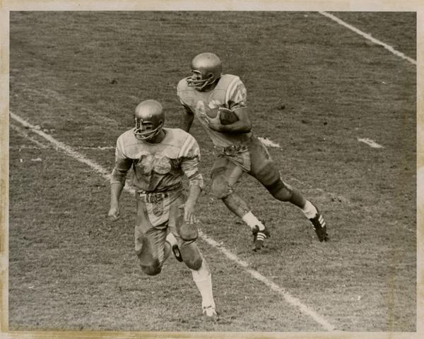 UCLA football player, possibly Steve Durbin, on the field during a game, ca. 1960s