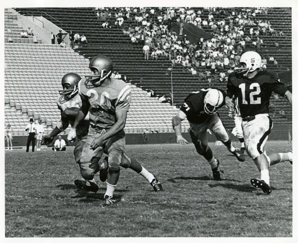 Football game action during UCLA v. Stanford game, ca. 1960s