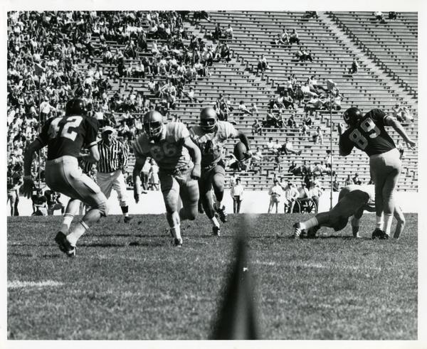 Football game action during UCLA v. Cal game, ca. 1960s