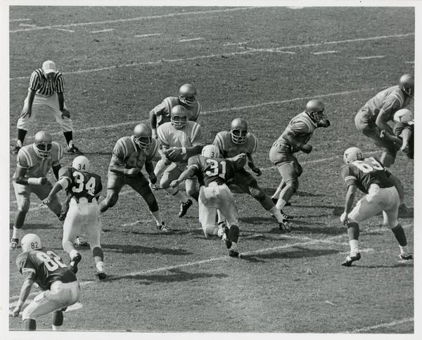 Football game action during UCLA v. Texas game, ca. 1970